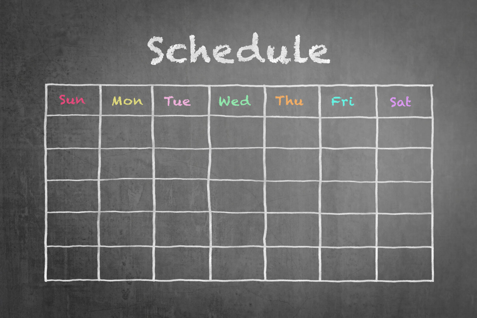 Sunday through Saturday grid schedule on a chalkboard