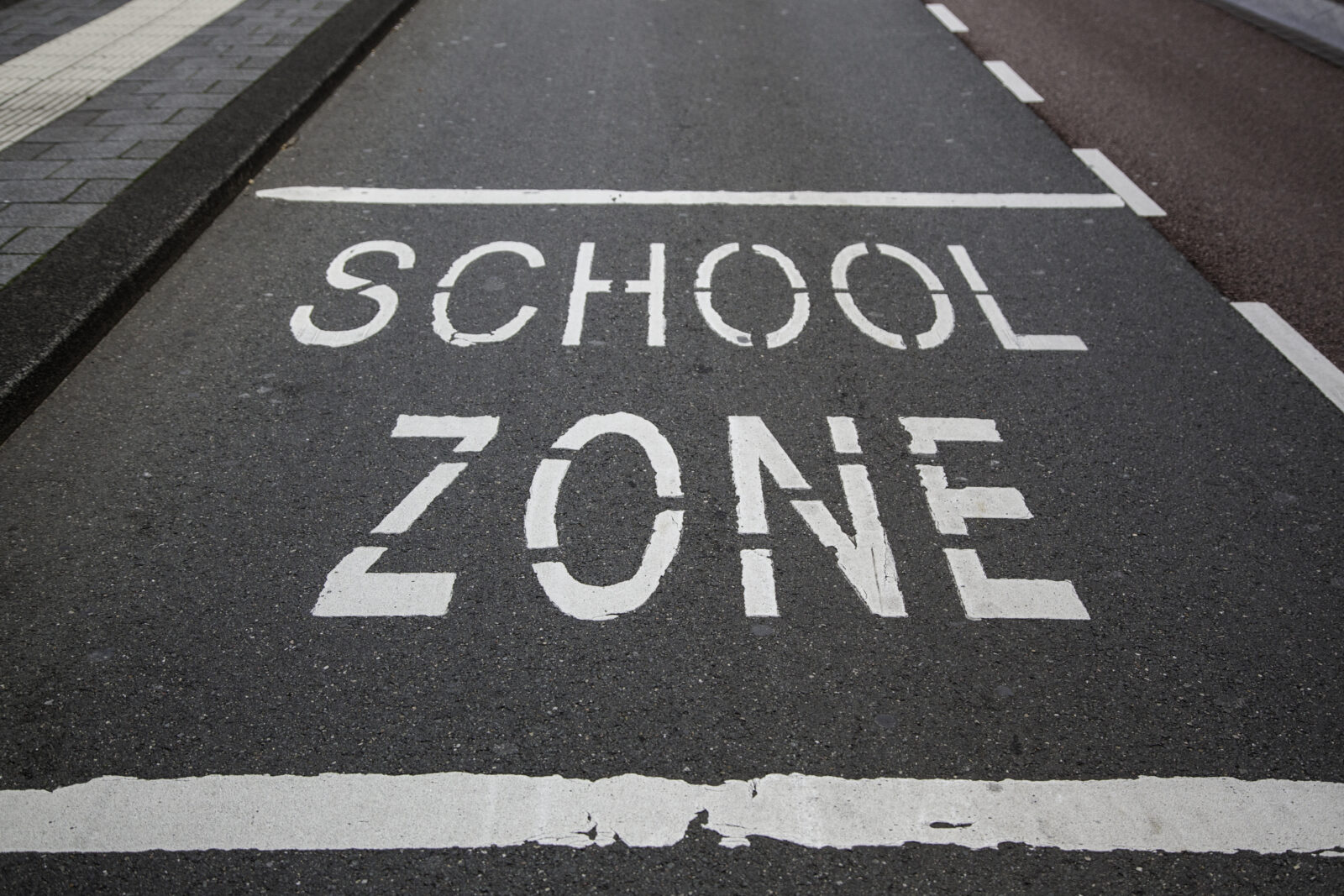School zone written on street