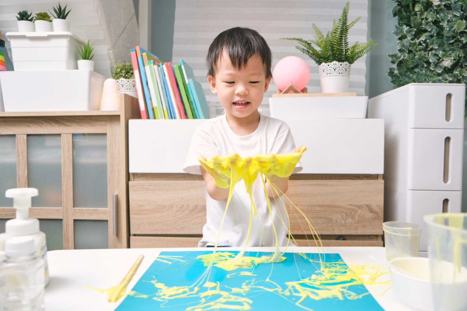 Little boy exploring with slime