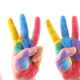 Painted hands doing sign language numbers one through five