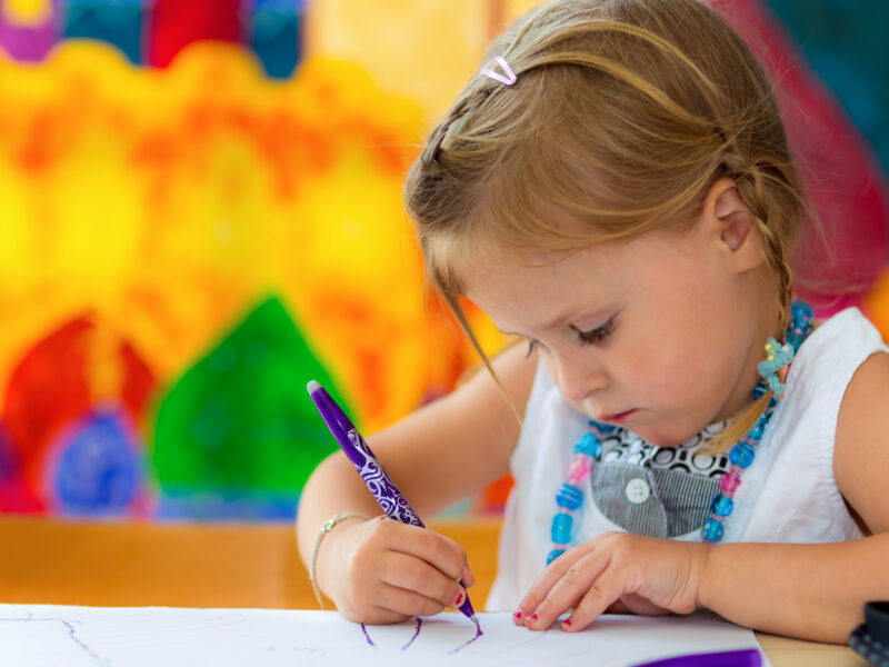 Little girl writing